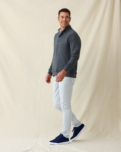 Men's Foothill V2 Placket in Charcoal, full-length side view on model featuring a charcoal heathered fleece pullover with snap button placket and mock collar, styled with light grey pants and navy shoes