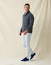 Men's Foothill V2 Placket in Charcoal, full-length side view on model featuring a charcoal heathered fleece pullover with snap button placket and mock collar, styled with light grey pants and navy shoes