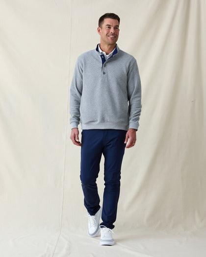 Men's Foothill V2 Placket in Heather, full-length front view on model featuring a grey heathered fleece pullover with snap button placket and mock collar with navy interior, styled with navy pants and white shoes