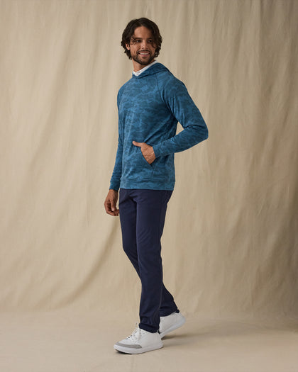 MacKenzie Hoodie in Petrol Camouflage Blue, side model view styled with navy pants