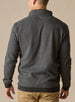 Men's Harrison Quarter Zip in Black, back model view featuring a charcoal herringbone knit body with tonal logo embroidery at the upper back, layered over a black collared shirt with khaki pants