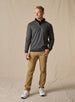 Men's Harrison Quarter Zip in Black, full length model view featuring a charcoal herringbone knit body with ribbed cuffs and hem and quarter-zip closure with leather pull tab, layered over a black collared shirt, styled with khaki pants and white shoes