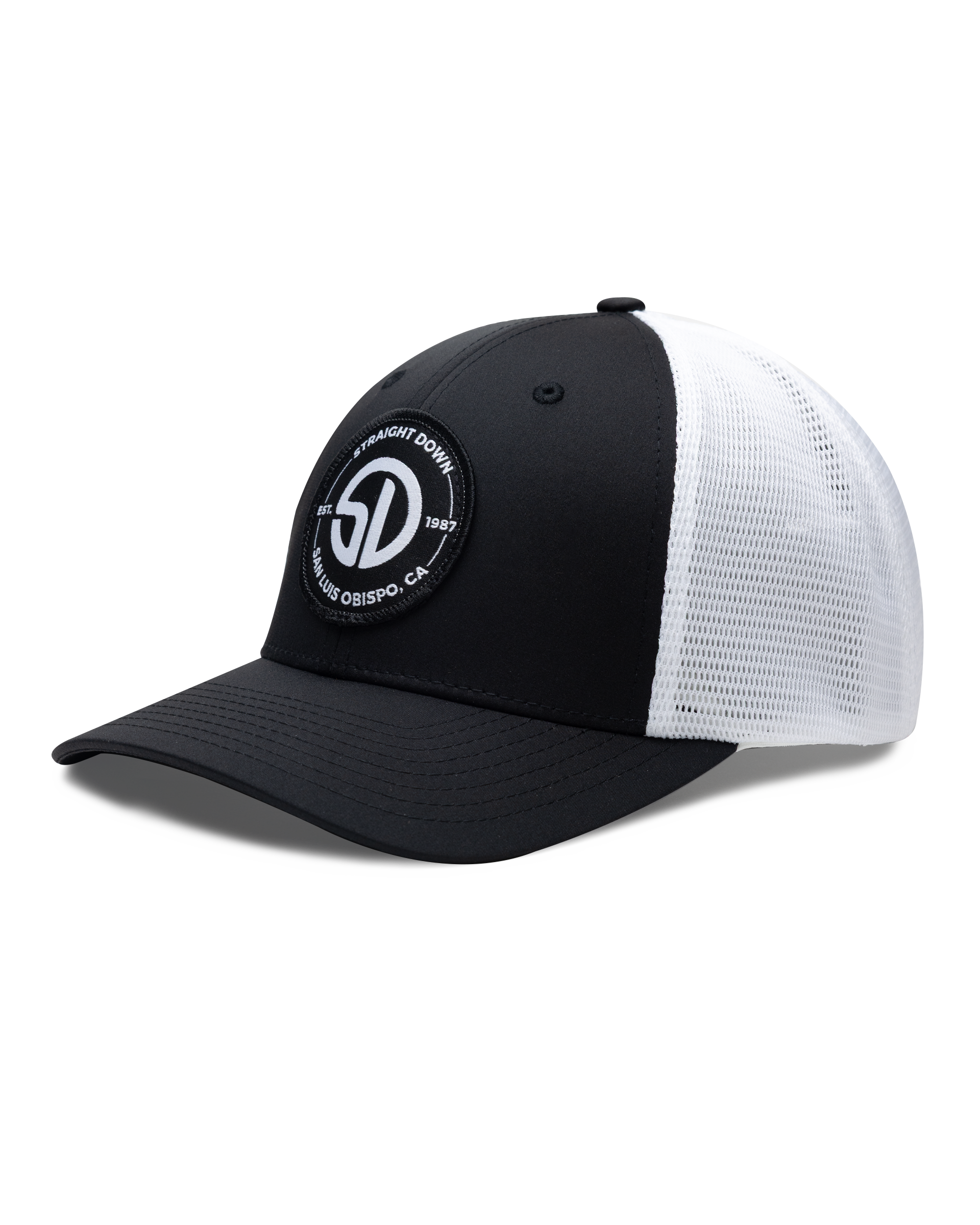 Circle Hat in Black White, side view featuring a black structured trucker cap with a circular embroidered patch featuring the SD monogram logo encircled by 