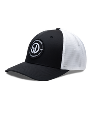 Circle Hat in Black White, side view featuring a black structured trucker cap with a circular embroidered patch featuring the SD monogram logo encircled by "Straight Down Est. 1987 San Luis Obispo, CA" text on the front panel, with white mesh back panels