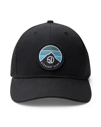 Night Landscape Hat in Black, front view featuring a black structured trucker cap with mesh back panels and a circular Straight Down logo patch with mountain and blue stripe design centered on the front panel
