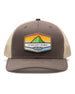 El Toro Hat in Brown, front view featuring a brown structured trucker cap with a woven mountain sunset landscape patch and Straight Down logo on the front panel, with tan mesh back panels and tan contrast stitching on the brim