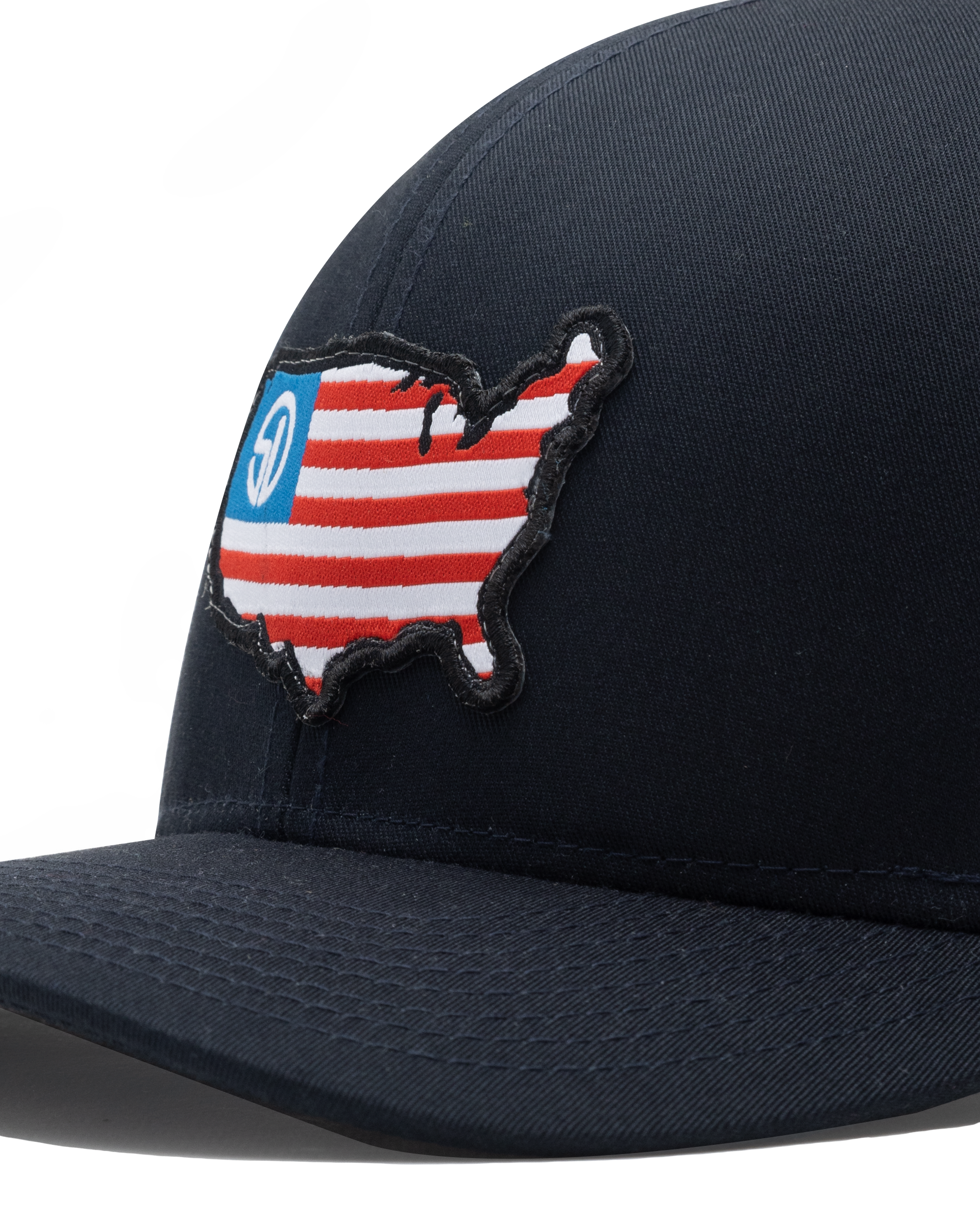 Close-up of the United Hat's embroidered USA flag map patch with the Straight Down logo on the navy front panel.