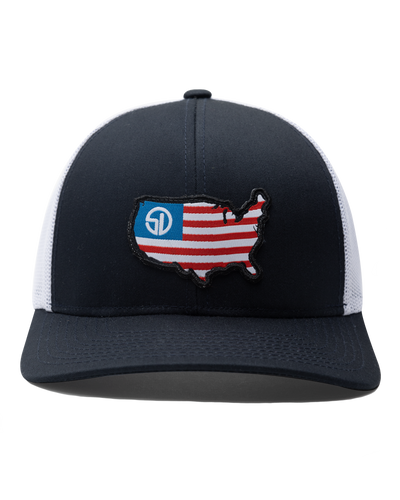 Front view of the United Hat in Navy/White with an embroidered USA flag map patch and Straight Down logo on the navy crown.