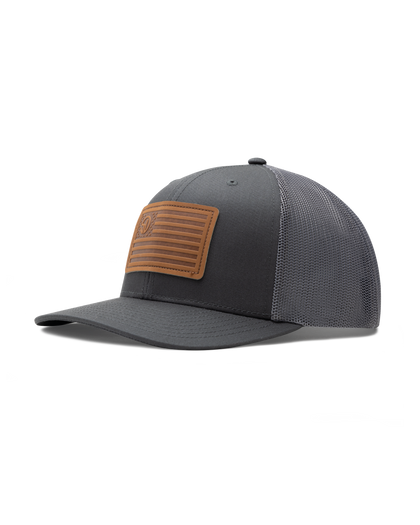 Straight Down SD Flag Hat in Charcoal, front angle view showing charcoal structured front panel with grey mesh sides and brown leather American flag patch with Straight Down logo