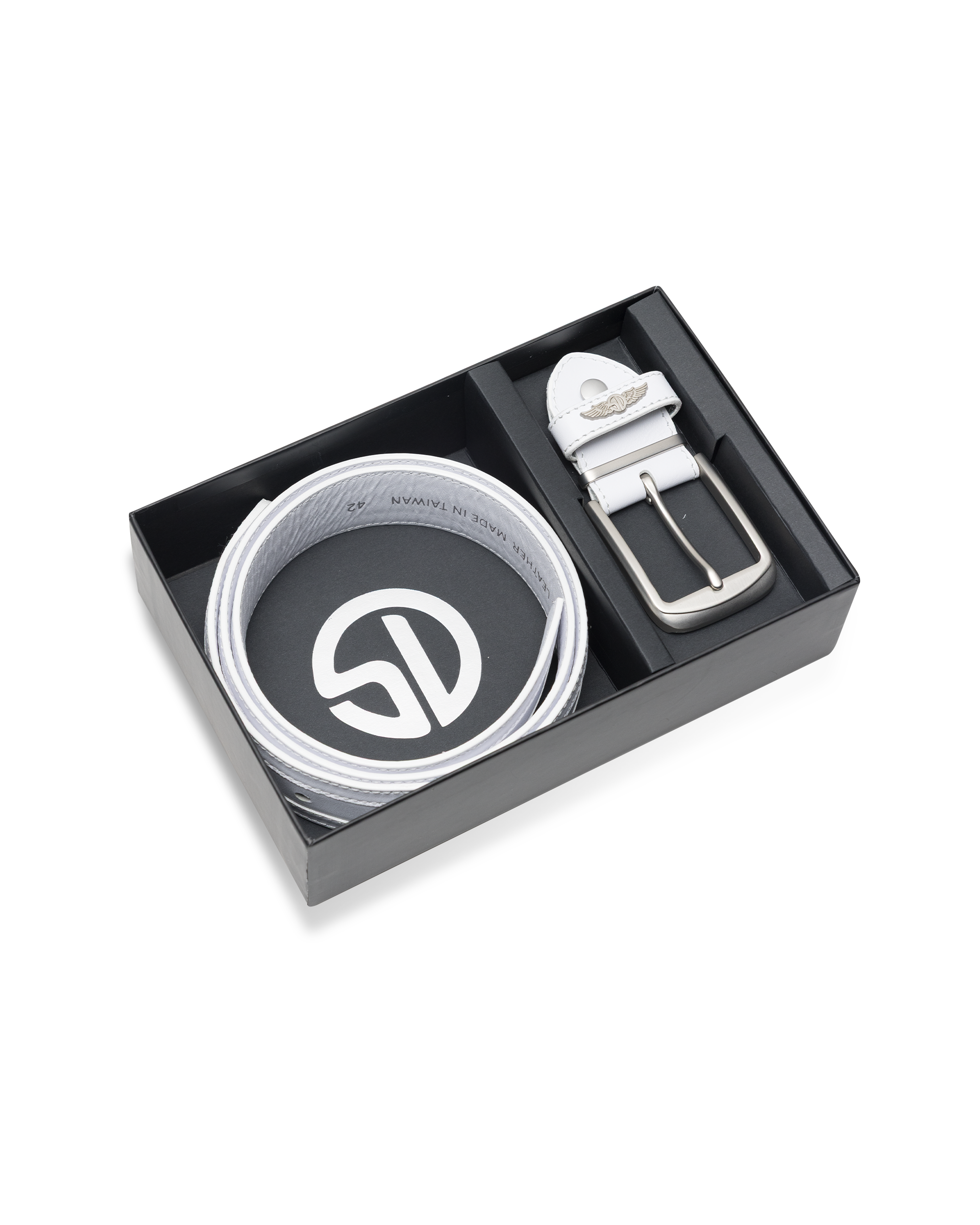 Straight Down Diplomat Belt in White, packaging view featuring the white leather belt coiled in a black gift box with a Straight Down branded insert, alongside the detached silver buckle