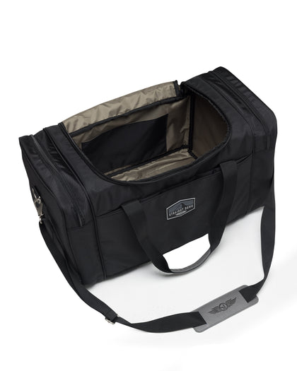 Straight Down Montana Duffle Bag in Black, open top view featuring a black nylon duffle bag with a gray interior lining, showing the spacious main compartment and Straight Down logo strap pad