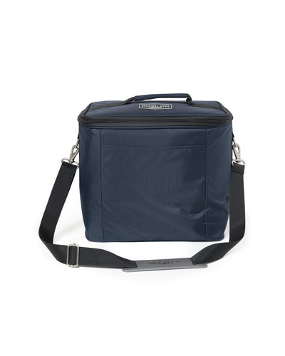 Straight Down Montana Cooler Bag in New Indigo, front view featuring a navy insulated cooler bag with a Straight Down mountain badge logo patch, front zip pocket, top carry handle, and adjustable black crossbody strap