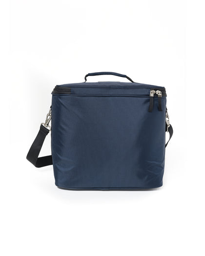 Straight Down Montana Cooler Bag in New Indigo, back view featuring a navy insulated cooler bag with a top carry handle, zip closure, and adjustable black crossbody strap with silver clip hardware