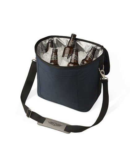 Straight Down Montana Cooler Bag in New Indigo, open top view featuring a navy insulated cooler bag filled with ice and bottles, showing the silver insulated interior lining and a Straight Down logo on the shoulder strap pad