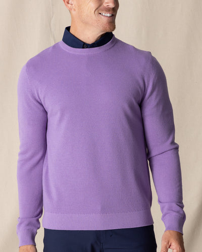 Men's Links Crewneck Sweater in Amethyst, front on-model view featuring a medium purple textured knit fabric with a crew neckline, styled with a navy collared shirt and navy pants