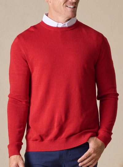 Men's Links Crewneck Sweater in Flag Red, front on-model view featuring a bold red textured knit fabric with a crew neckline, styled with a white collared shirt and navy pants