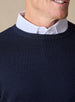 Men's Links Crewneck Sweater in New Indigo, close-up detail view of the ribbed crew neckline and textured knit fabric, layered over a white collared shirt