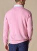 Men's Links Crewneck Sweater in Pink Lemonade, back on-model view featuring a soft pink textured knit fabric with an embroidered Straight Down logo at the upper back, styled with a white collared shirt and navy pants