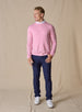 Men's Links Crewneck Sweater in Pink Lemonade, full-length on-model view featuring a soft pink textured knit fabric with a crew neckline, styled with a white collared shirt, navy pants, and white shoes