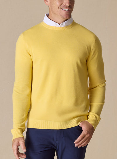 Men's Smithson Links Crewneck Sweater in Sunshine, front model view featuring a yellow textured knit body with ribbed cuffs and hem, styled over a white collared shirt with navy pants