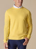 Men's Smithson Links Crewneck Sweater in Sunshine, front model view featuring a yellow textured knit body with ribbed cuffs and hem, styled over a white collared shirt with navy pants