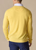 Men's Smithson Links Crewneck Sweater in Sunshine, back model view featuring a yellow textured knit body with ribbed cuffs and hem, tonal logo embroidery at the upper back, styled over a white collared shirt with navy pants