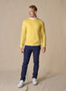 Men's Smithson Links Crewneck Sweater in Sunshine, full length model view featuring a yellow textured knit body with ribbed cuffs and hem, styled over a white collared shirt with navy pants and white shoes
