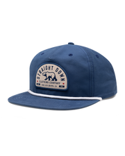 Bear Country Rope Hat in New Indigo, side view featuring a cream and navy arched Straight Down Clothing Company bear patch on the front panel with a white rope detail along the brim