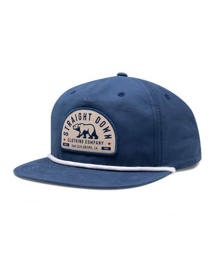 Bear Country Rope Hat in New Indigo, side view featuring a cream and navy arched Straight Down Clothing Company bear patch on the front panel with a white rope detail along the brim