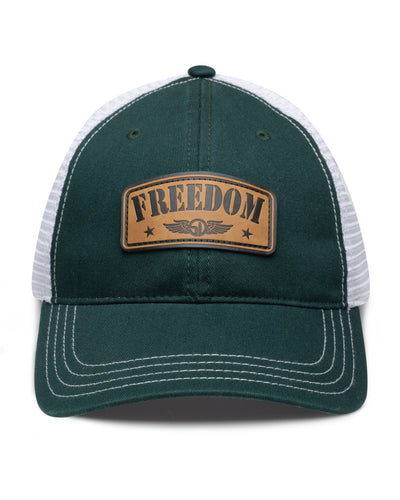 Freedom Hat in Green, front view featuring a forest green structured trucker cap with a leather patch reading "Freedom" and Straight Down logo on the front panel, white mesh back panels, and white contrast stitching on the brim
