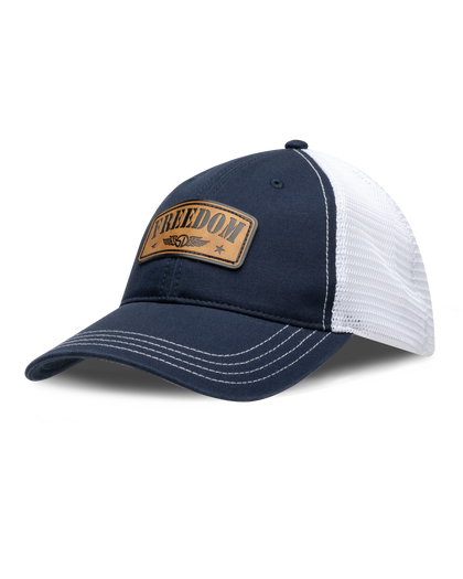 Freedom Hat in Navy, side view featuring a navy and white mesh trucker hat with a leather "Freedom" and Straight Down logo patch on the front panel with white contrast stitching