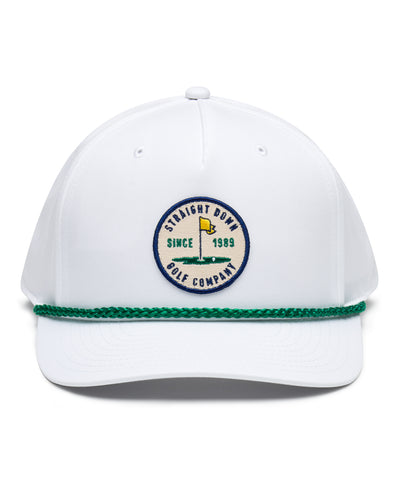 Pin High Rope Hat in White Kelly, front view featuring a Straight Down Golf Company circular patch depicting a golf hole with a yellow flag, "Since 1989" text, on a white hat with a green rope brim detail
