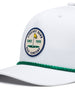 Pin High Rope Hat in White Kelly, close-up detail of the Straight Down Golf Company circular patch depicting a golf hole with a yellow flag and "Since 1989" text, with a green rope brim detail