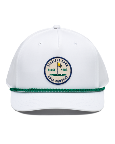 Pin High Rope Hat in White Kelly, front view featuring a Straight Down Golf Company circular patch depicting a golf hole with a yellow flag, "Since 1989" text, on a white hat with a green rope brim detail