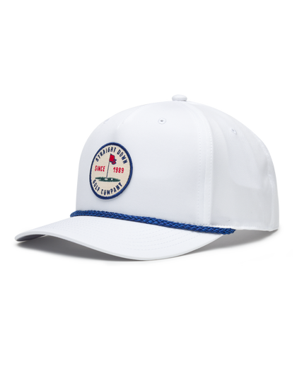 Men's Pin High Rope Hat in White, side view featuring a solid white hat with blue braided rope detail along the brim and a circular Straight Down Golf Company Since 1989 embroidered patch on the front panel