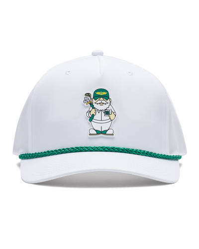 A white cap featuring a green braided trim along the edge of the brim and a small illustrated golf caddie gnome on the front.