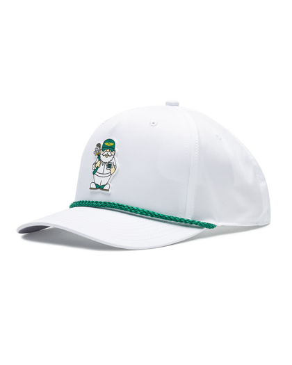 A white cap featuring a green braided trim along the edge of the brim and a small illustrated golf caddie gnome on the front.