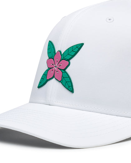 Close-up of the Azalea Hat in White featuring a pink azalea flower logo