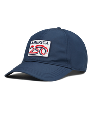 A navy structured baseball cap with a curved brim, featuring a front patch that reads 'AMERICA 250' in navy, red, and white. The cap has perforated side panels for ventilation.