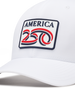 Detail shot of a white structured baseball cap with a curved brim, featuring a front patch that reads 'AMERICA 250' in navy, red, and white. The cap has perforated side panels for ventilation.