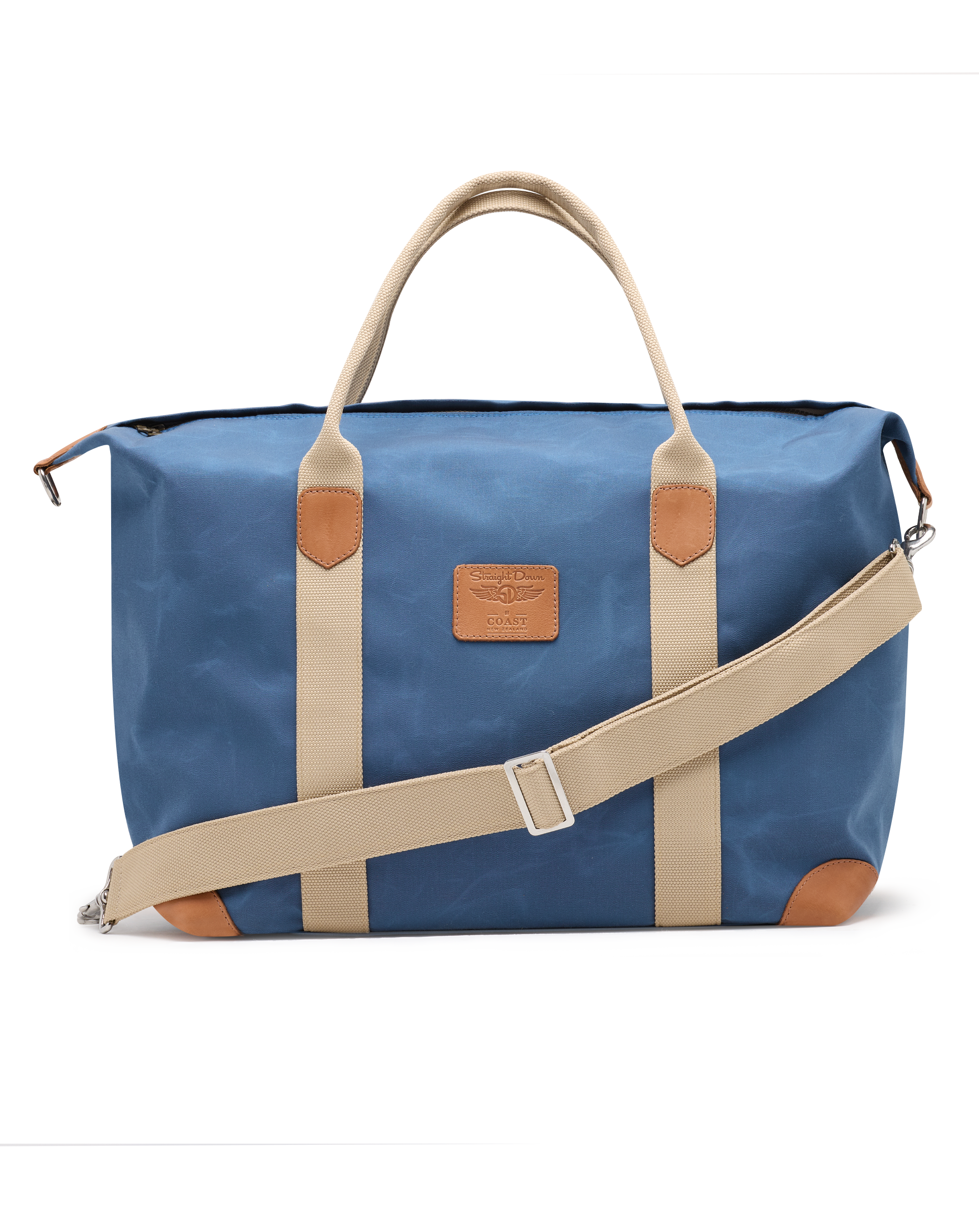 Weekender Bag in Moonlight, front product view featuring a blue waxed canvas body with tan canvas handles, tan leather trim accents, adjustable shoulder strap, and Straight Down logo patch