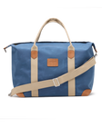 Weekender Bag in Moonlight, front product view featuring a blue waxed canvas body with tan canvas handles, tan leather trim accents, adjustable shoulder strap, and Straight Down logo patch