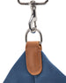 Weekender Bag in Moonlight, close-up detail view of the removable shoulder strap featuring a silver clip hardware and tan leather attachment tab