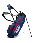 Straight Down Lux Carry Stand Bag in Navy Red, front angle view featuring white Straight Down wing logo, red zipper accents, American flag patch, dual shoulder straps, and deployed kickstand legs
