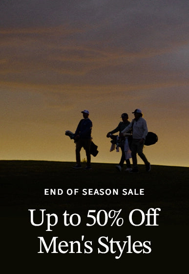 Golfer carrying clubs at sunset promoting the Straight Down End of Season Sale with up to 50% off men's styles.