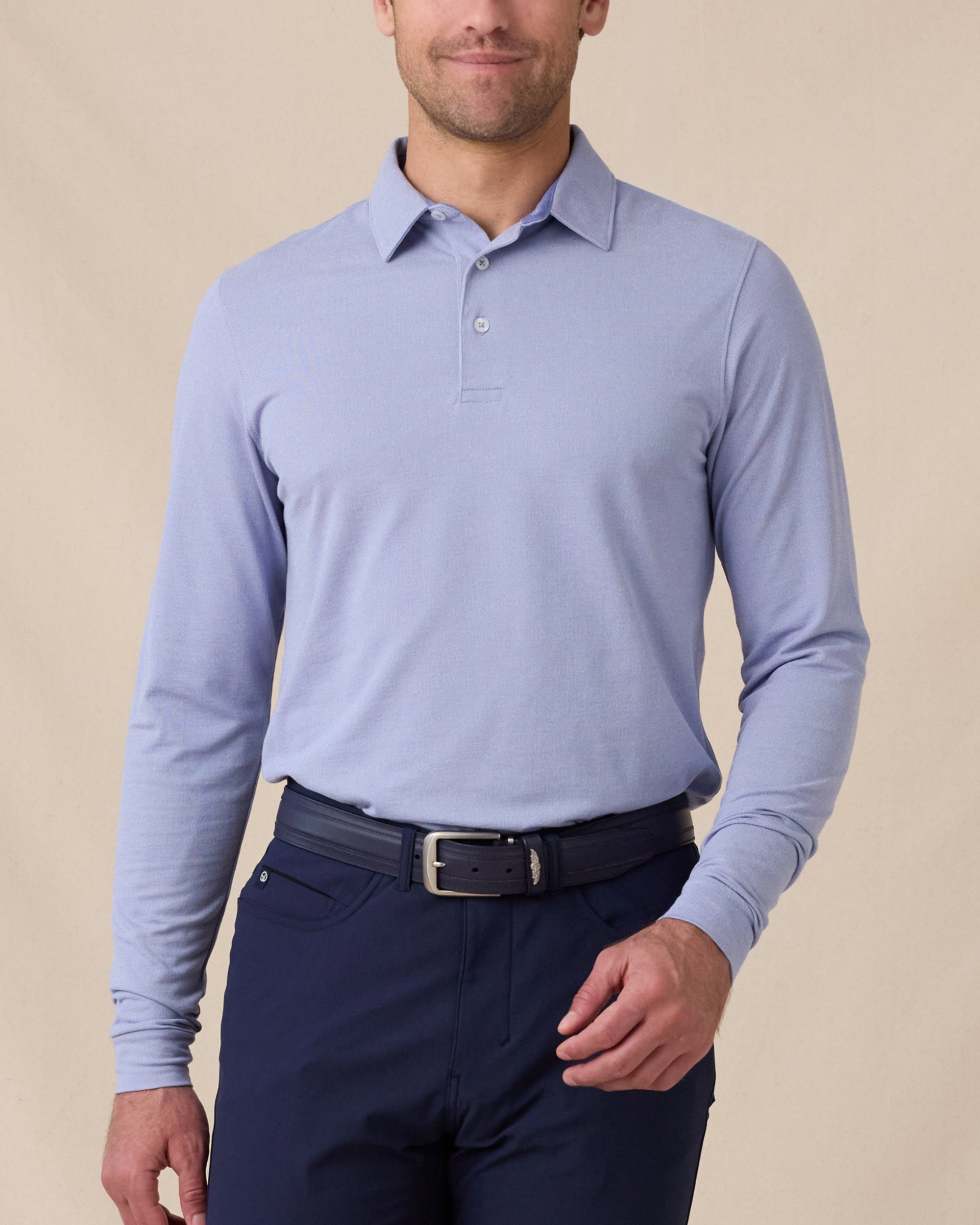 Model wearing the Cambridge Long Sleeve Polo in Chambray Blue, front view