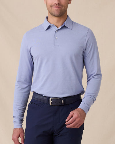 Model wearing the Cambridge Long Sleeve Polo in Chambray Blue, front view