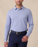 Model wearing the Cambridge Long Sleeve Polo in Chambray Blue, front view