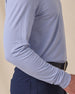 Close-up of the Cambridge Long Sleeve Polo in Chambray Blue showcasing the lightweight performance fabric