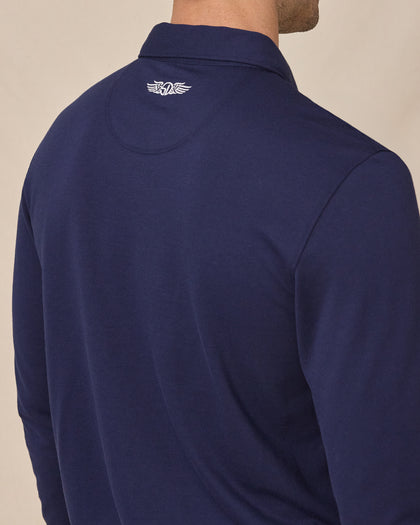 Close-up of the Cambridge Long Sleeve Polo in New Indigo featuring the embroidered Straight Down logo at the back neck